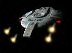 USS Defiant firing its phaser cannons